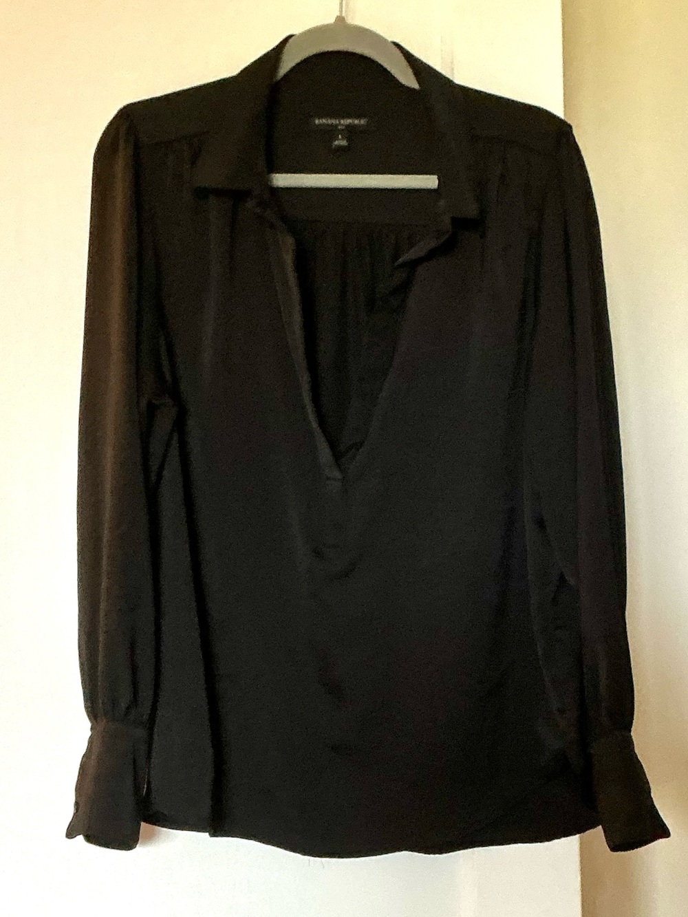 Banana Republic Factory black long sleeve blouse. Low V collar. Size Large.